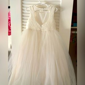 Little girls flower girl dress with a open heart shape design in back.